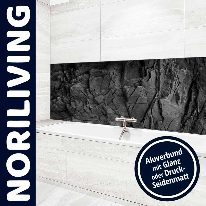 Badezimmer mit eleganter Steinoptik-Wand und Badewanne von Noriliving
