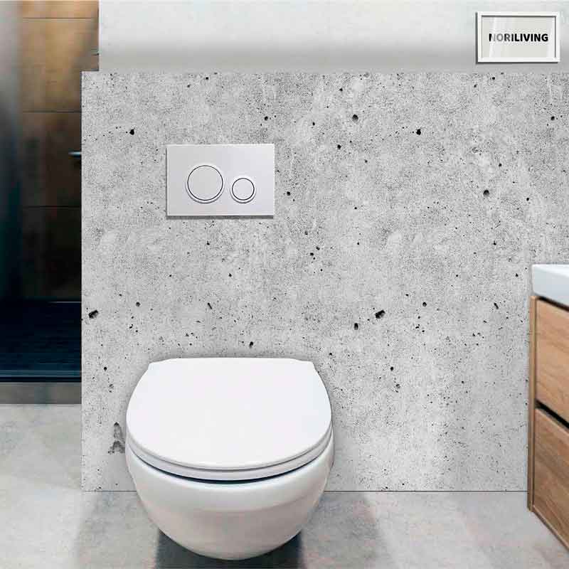 Modernes Wand-WC mit Betonhintergrund Wandhängendes WC vor Betonwand in modernem Badezimmer