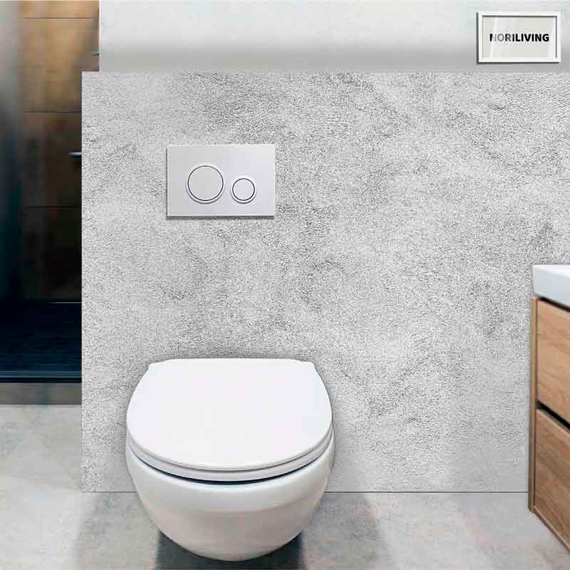 Moderne wandhängende Toilette mit Betonstruktur im Badezimmer Wandhängende Toilette vor einer grauen Betonwand mit moderner Spültaste im Badezimmer