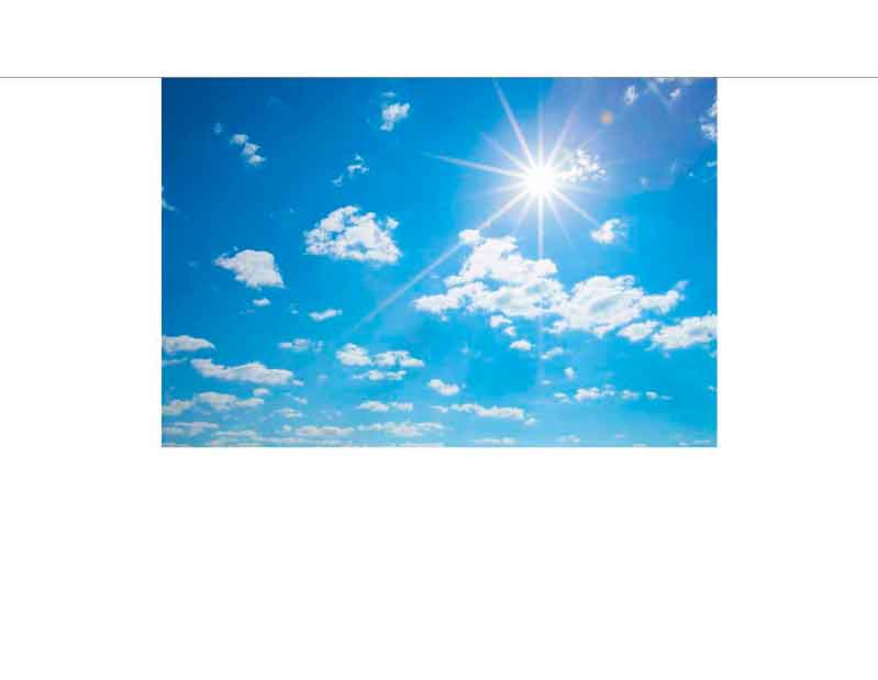 Ein strahlend blauer Himmel mit Sonnenschein und einigen weißen Wolken.