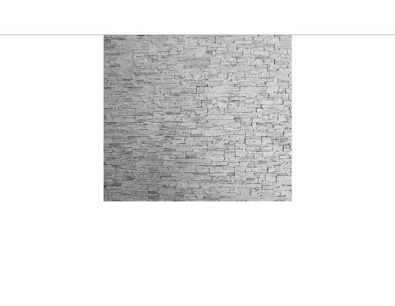 Graue Steinwand mit strukturiertem Design, ideal für moderne Innenräume