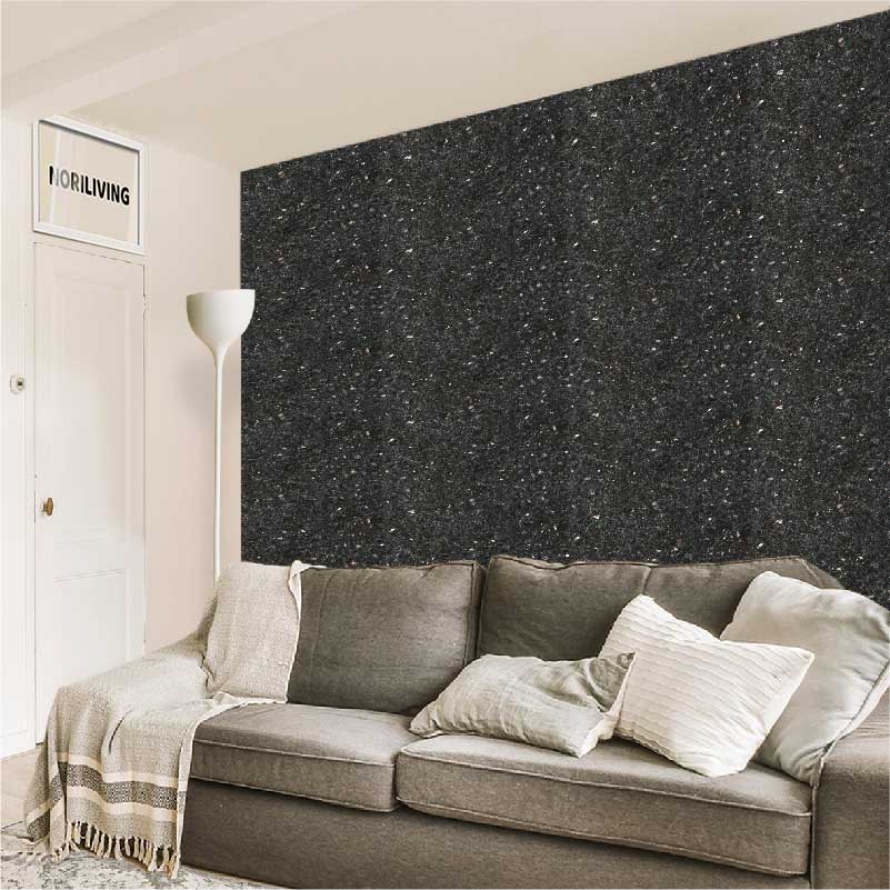 Modernes Wohnzimmer mit grauer Couch und stilvoller Akzentwand Ein modernes Wohnzimmer mit einer grauen Couch, dekorativen Kissen und einer stilvollen dunklen Akzentwand.