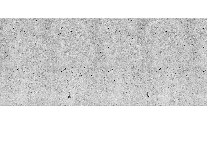 Betonwand mit leicht poröser Oberfläche Nahaufnahme einer grauen Betonwand mit kleinen Poren und unregelmäßigen Mustern